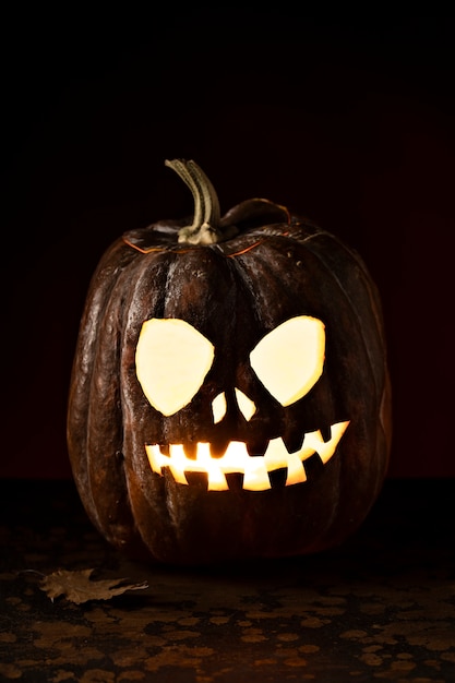 Free Photo spooky halloween pumpkin carving