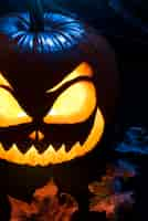 Free photo spooky halloween pumpkin on stairs high angle