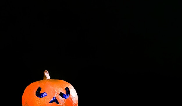 Free Photo spooky jack-o-lantern illuminating with blue light within