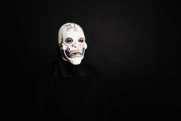 Spooky man in white Halloween mask