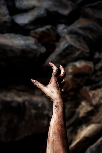 Free photo spooky zombie hand in nature