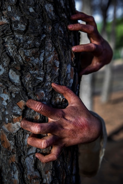 Spooky zombie hands on a tree