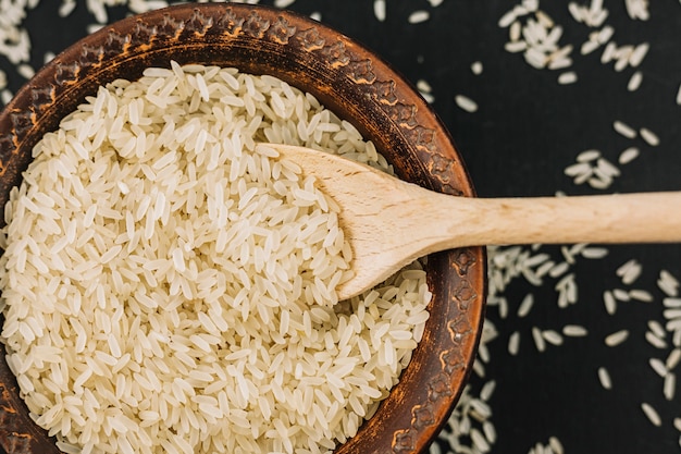 Free Photo spoon in bowl with rice