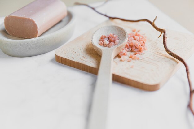 Spoon with salt near soap