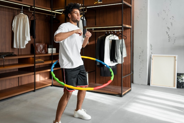 Sport person training with hula hoop