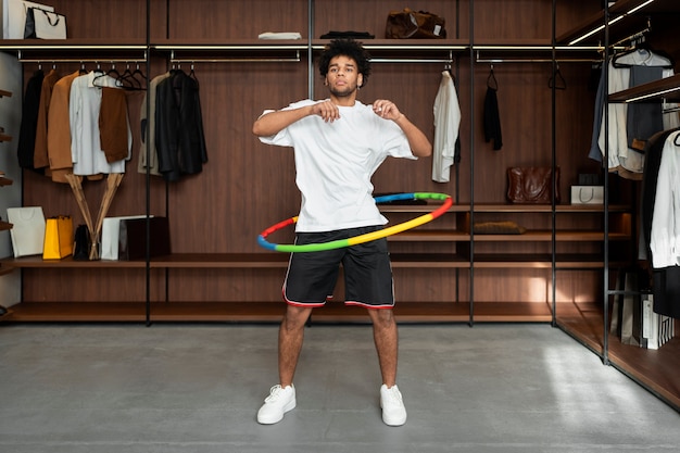 Free photo sport person training with hula hoop