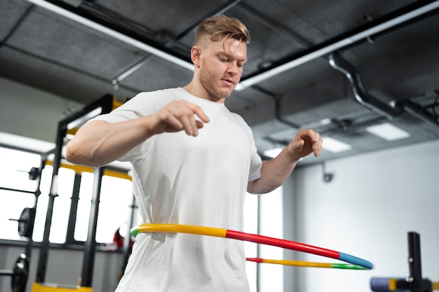 Sport person training with hula hoop