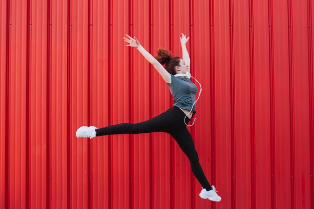 Sportive woman flying in jump