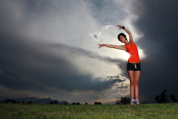 Sportive woman stretching