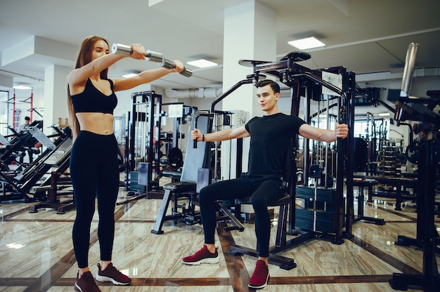 Free photo sports couple in a morning gym