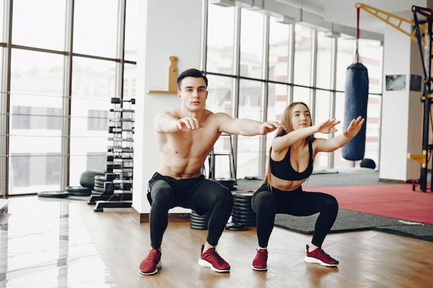 Sports couple in a morning gym