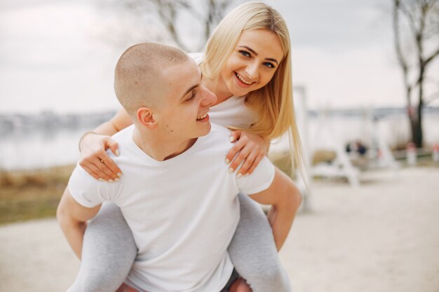 Sports couple in a summer park