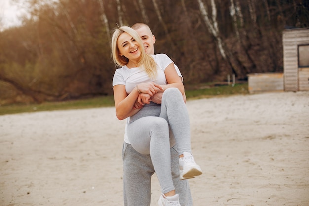 Sports couple in a summer park