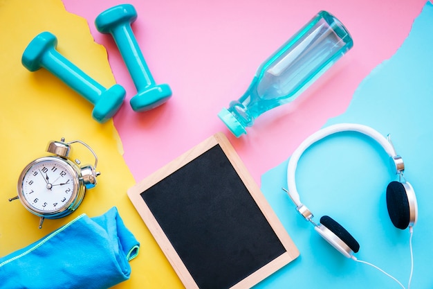 Sports equipment around blackboard