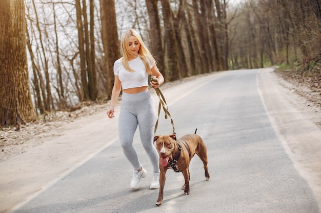 Sports girl in a morning summer park