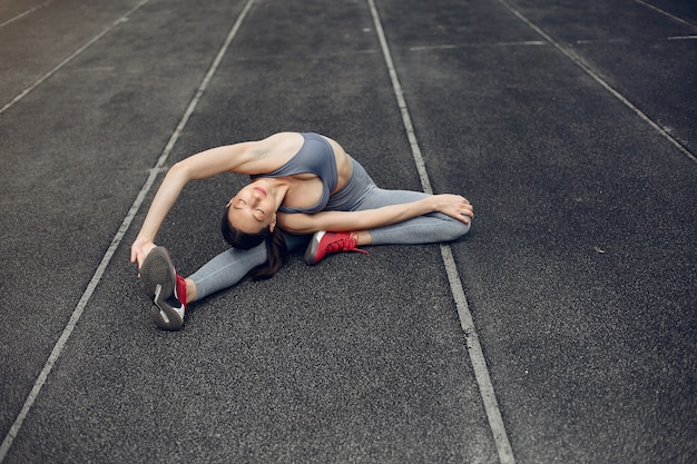 Free photo sports girl training at the stadium