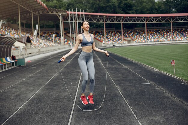 Sports girl training at the stadium