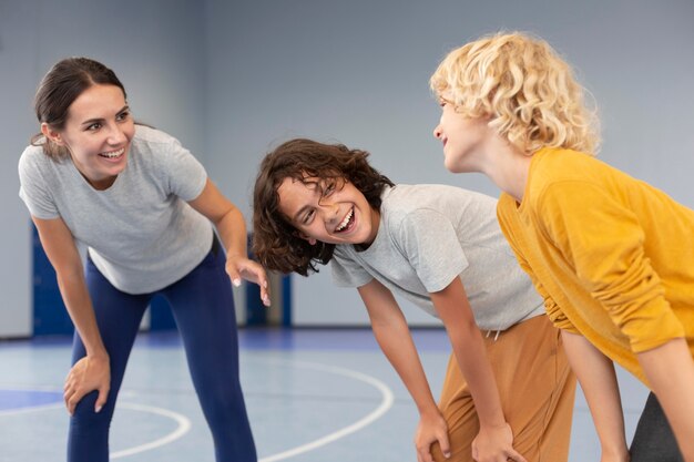 Sports teacher with her students