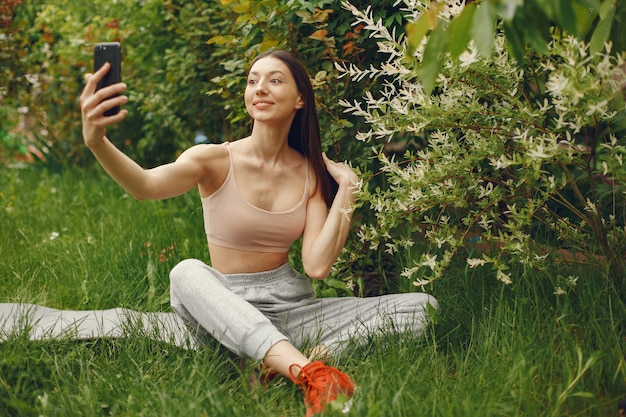 Free photo sports woman spending time in a spring park