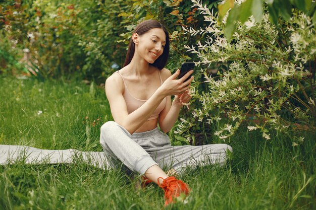 Sports woman spending time in a spring park