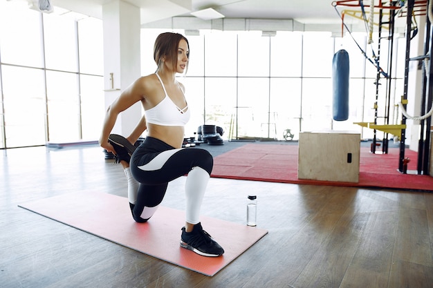 Sports woman training in a morning gym