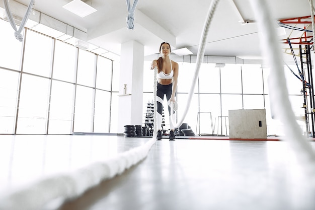 Free Photo sports woman training in a morning gym