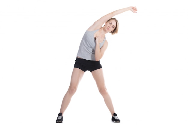 Sportswoman stretching her right arm