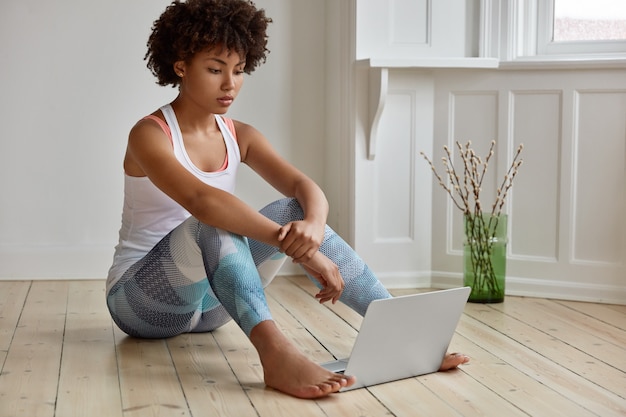 sporty woman posing in her home