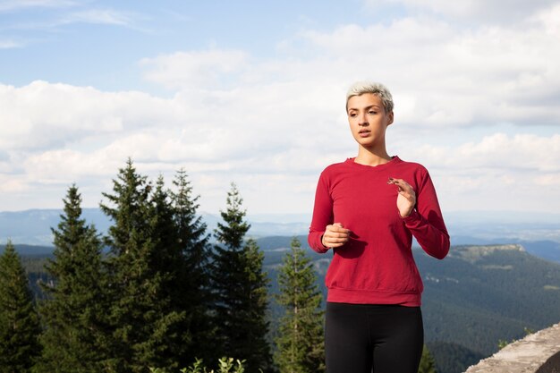 Sporty woman running in nature