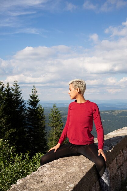 Sporty woman stretching in nature