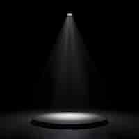 Free photo a spotlight on a black round stage with a dark room