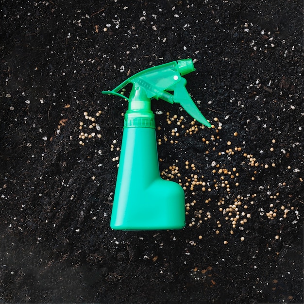 Free photo spray bottle on soil