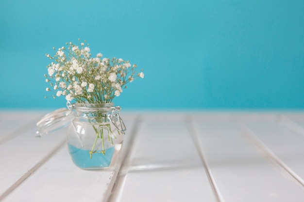 Spring background with flowers and vase