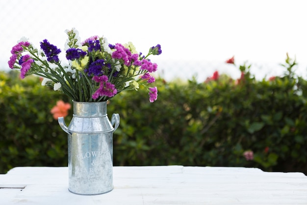 Free photo spring background with metallic vase