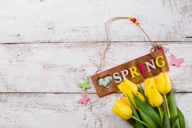 Spring background with yellow tulips