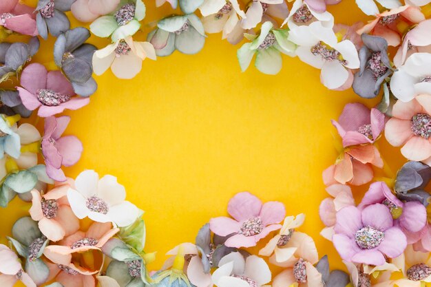 Spring banner with daisies on a yellow background with copy space