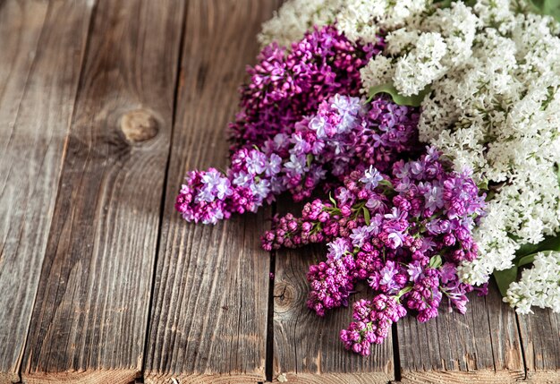 Spring composition with lilac flowers. Mother and woman's day.Flower delivery. Floral background.