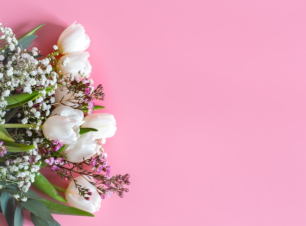 Free Photo spring flower arrangement on a pink wall