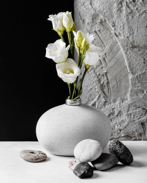 Free Photo spring flowers with a bunch of rocks arrangement