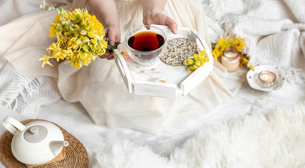 Spring still life with a Cup of tea and flowers