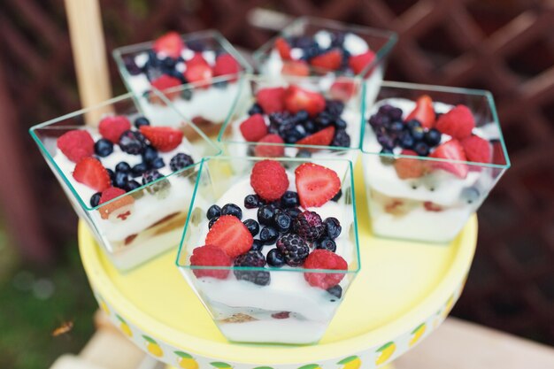 Square glasses with berry desserts