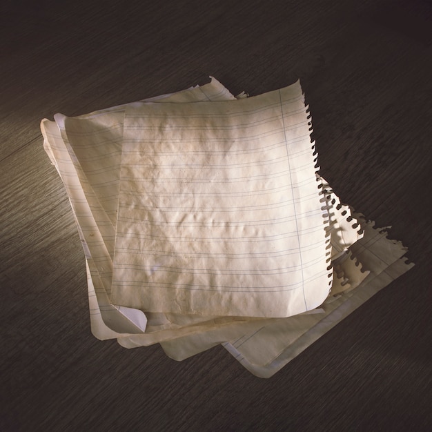 Free photo stack of aged paper sheets