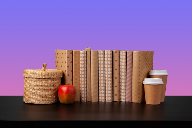 Free Photo stack of books on black wooden table