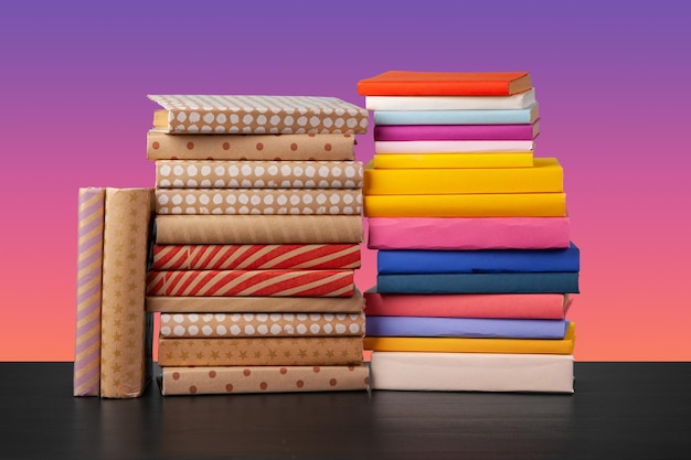 Stack of books on black wooden table