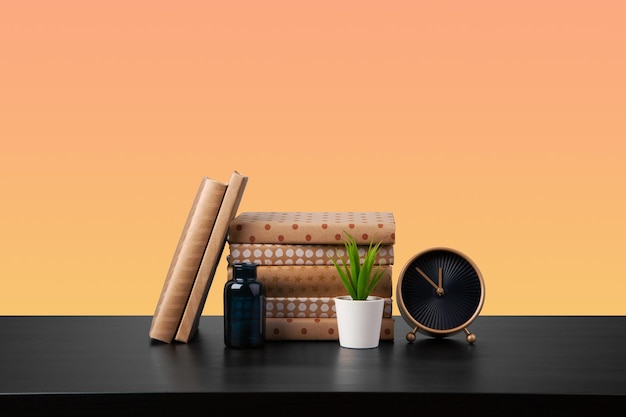 Free Photo stack of books on black wooden table