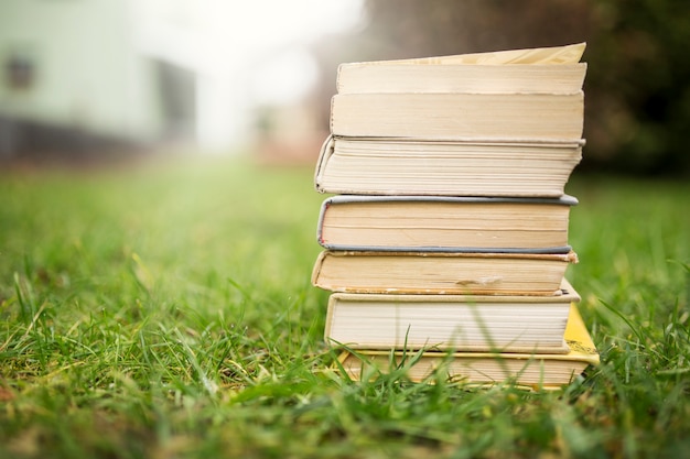 Stack of books on lawn