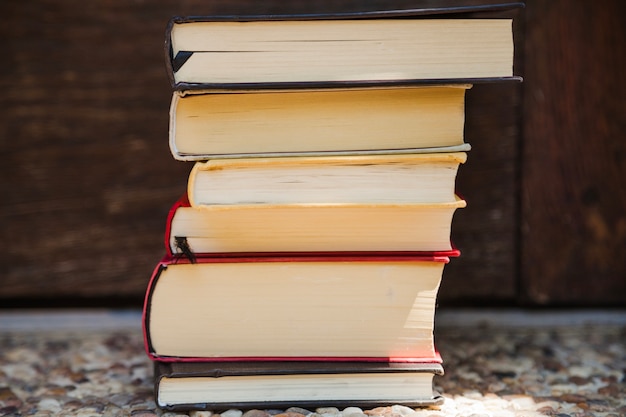 Stack of books standing on ground