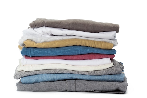 Free Photo stack of clothes on white background closeup