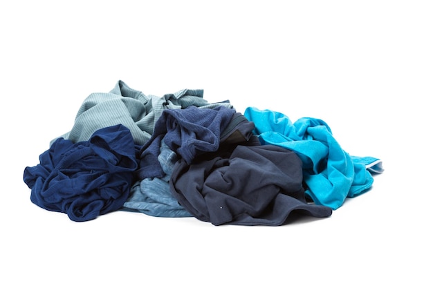 Stack of clothes on white background closeup