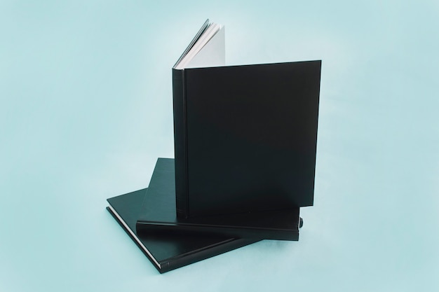 Free Photo stack of notebooks with black cover